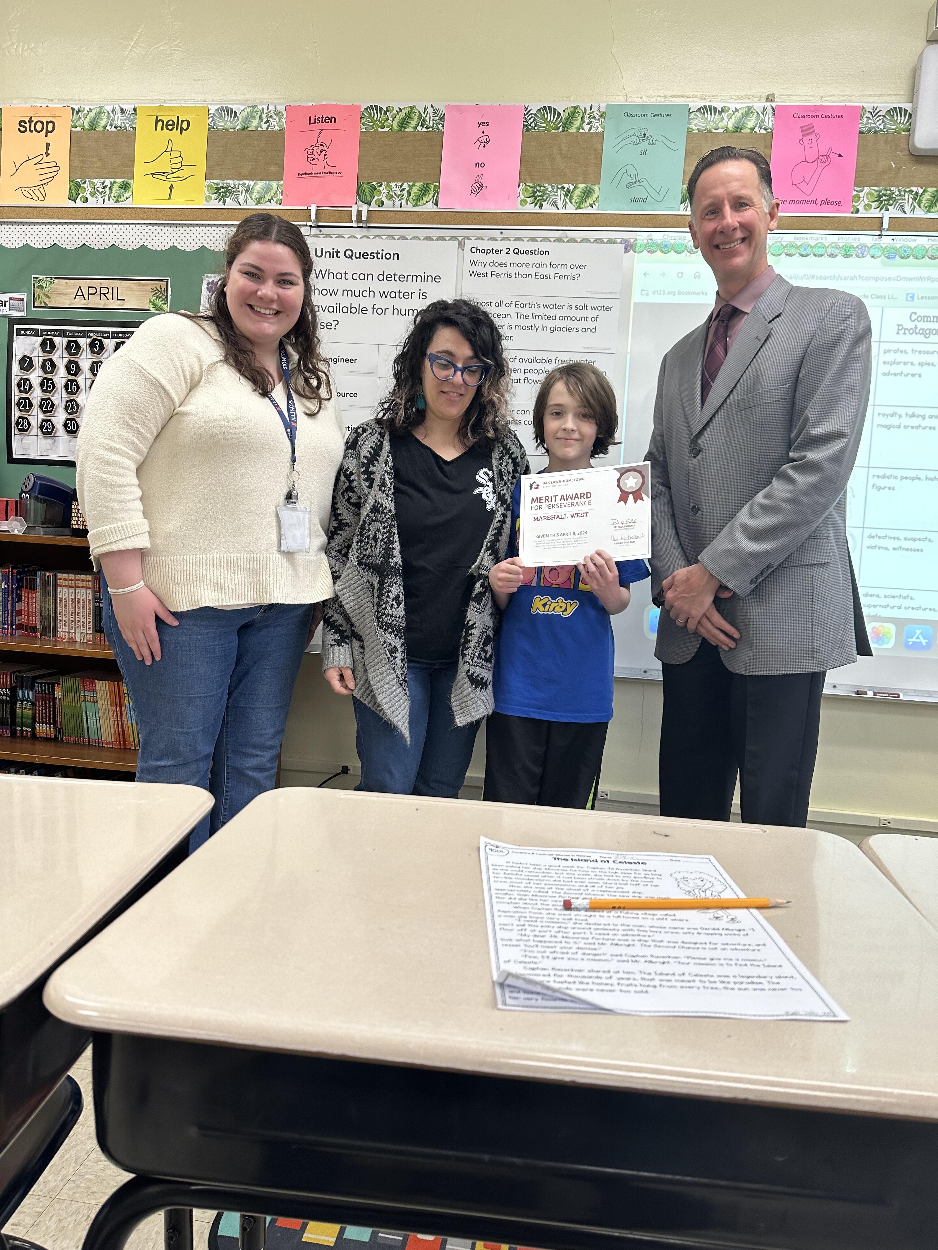 Student of the Week Receiving the award with family, their teacher, and Dr. Enderle